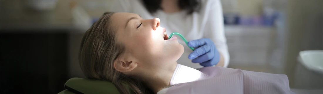 A person receiving a dental cleaning.