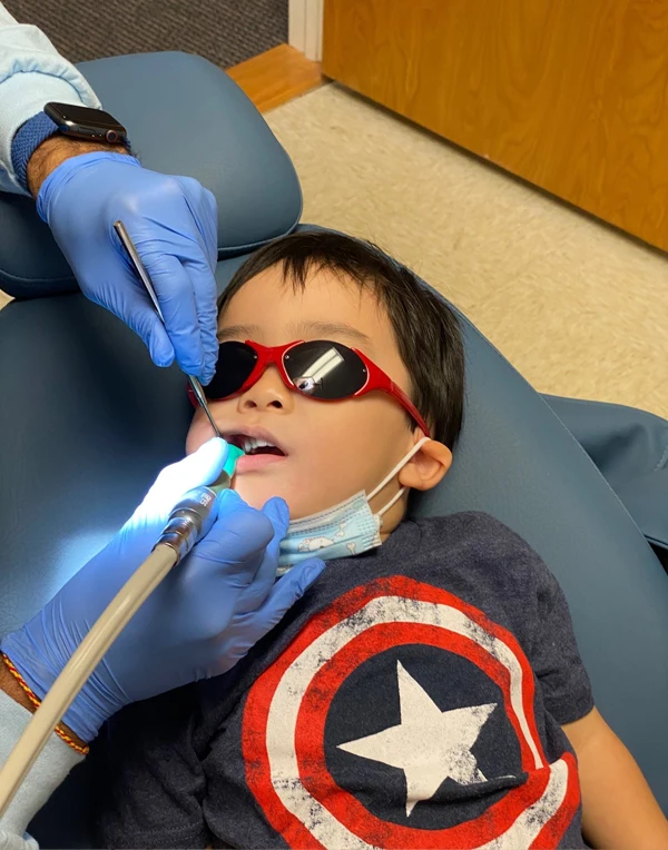A child receiving a dental exam.